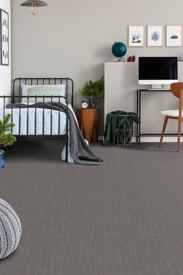 grey patterned carpet in modern kids room with twin beds and desk